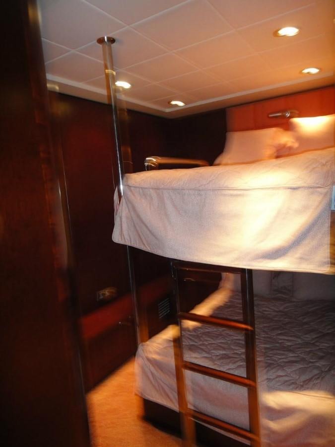 a bunk bed with a ladder aboard WARSAN Yacht for Sale