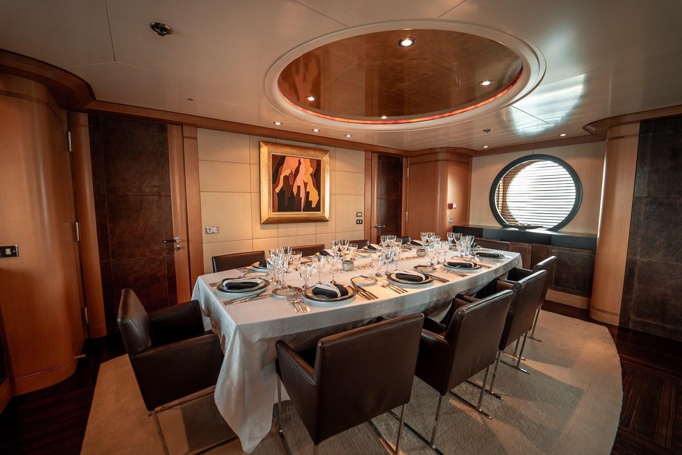 a large dining table with chairs aboard MERCURY Yacht for Sale