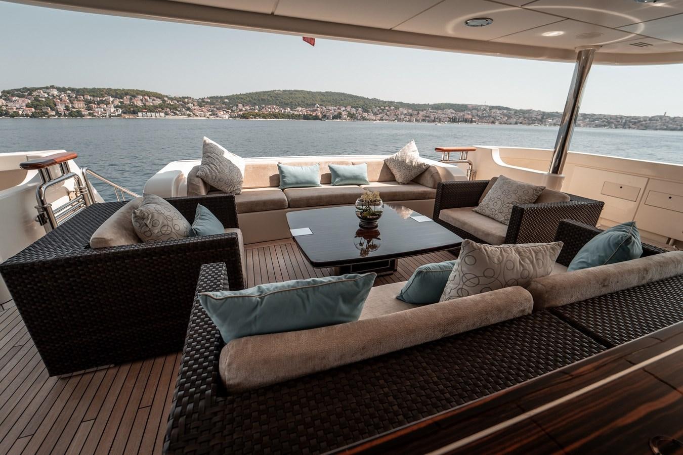 a living room with couches and pillows aboard MERCURY Yacht for Sale