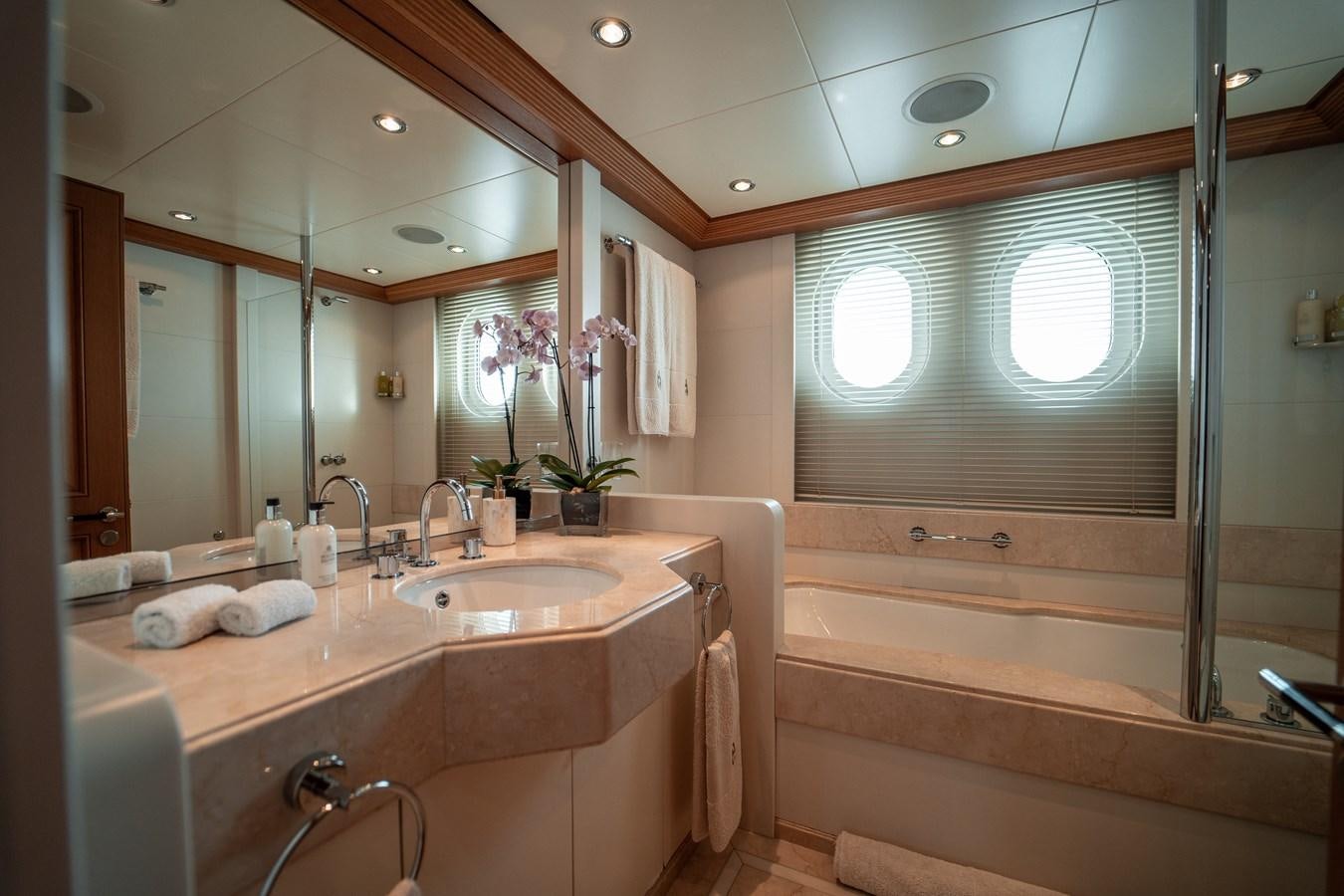 a bathroom with a large mirror aboard MERCURY Yacht for Sale
