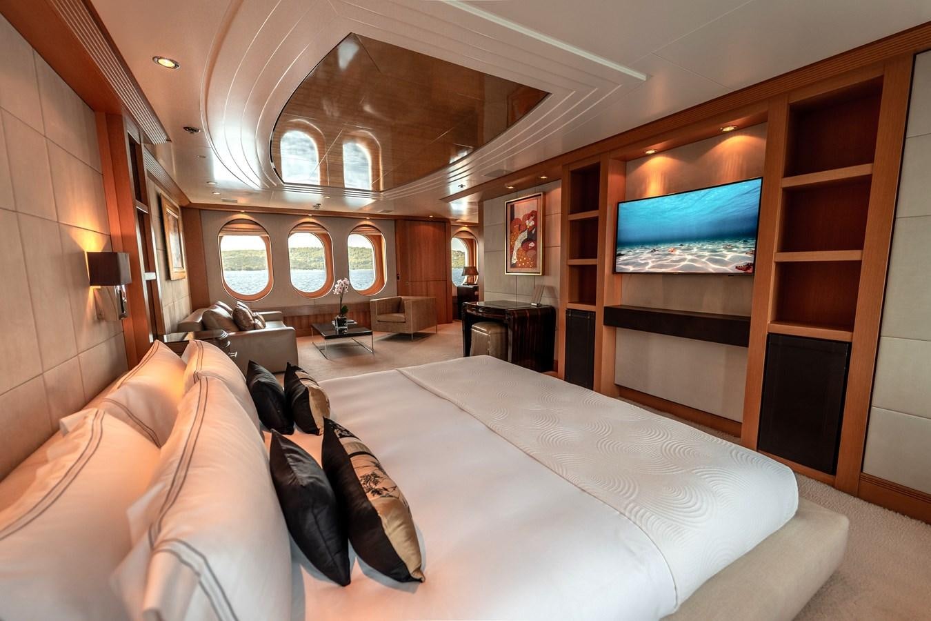 a room with a bed and a tv on the wall aboard MERCURY Yacht for Sale