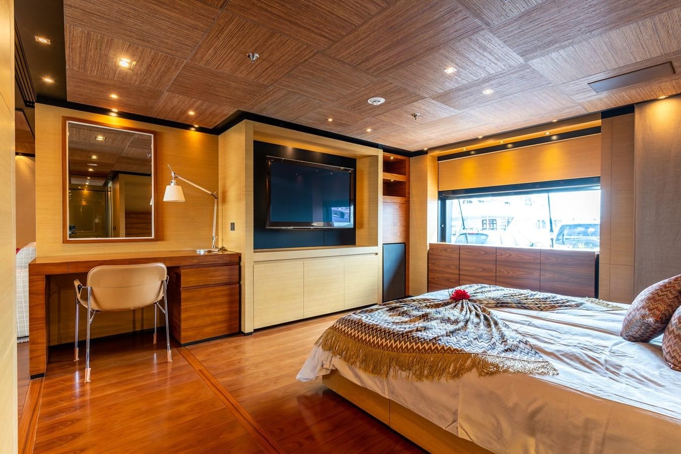 a bedroom with a large bed and a tv on the wall aboard UNDER CONTRACT!   SAINT  2012 ISA 500-2 POP @ Yacht for Sale