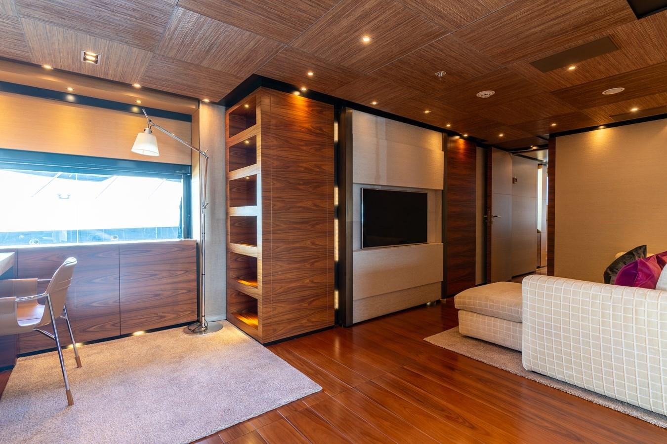 a living room with a wood cabinet aboard UNDER CONTRACT!   SAINT  2012 ISA 500-2 POP @ Yacht for Sale