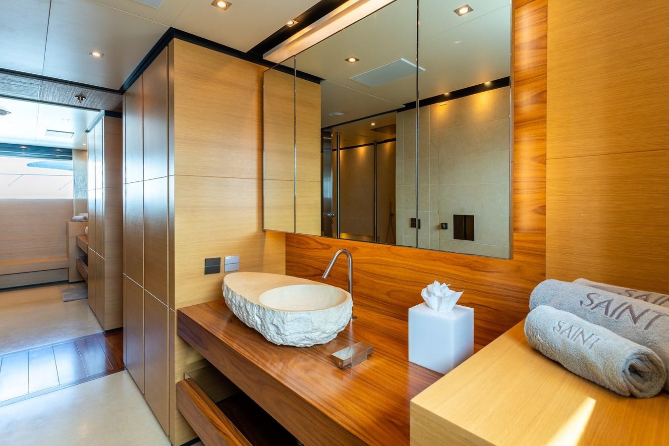 a bathroom with a sink and a mirror aboard UNDER CONTRACT!   SAINT  2012 ISA 500-2 POP @ Yacht for Sale