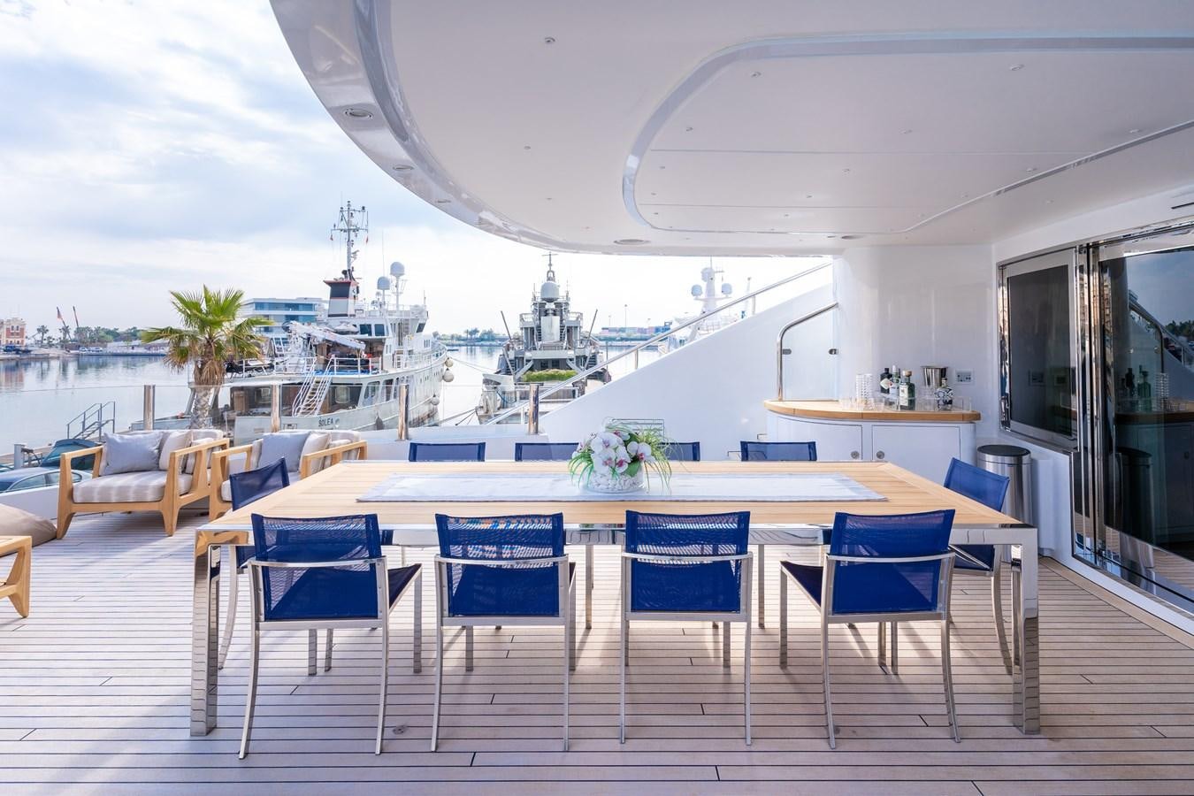 a patio with a table and chairs aboard UNDER CONTRACT!   SAINT  2012 ISA 500-2 POP @ Yacht for Sale