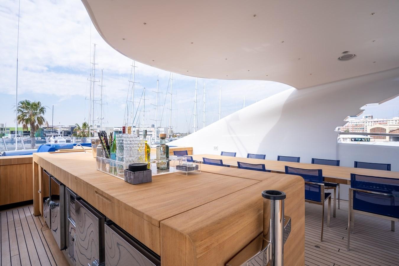 a table with chairs on it aboard UNDER CONTRACT!   SAINT  2012 ISA 500-2 POP @ Yacht for Sale