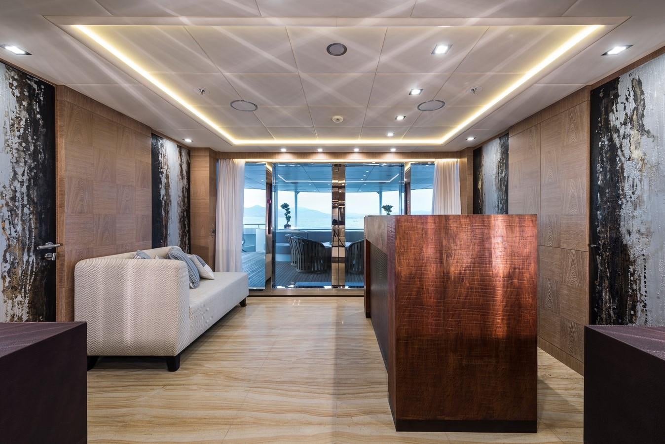 a room with a couch and a table aboard I NOVA Yacht for Sale