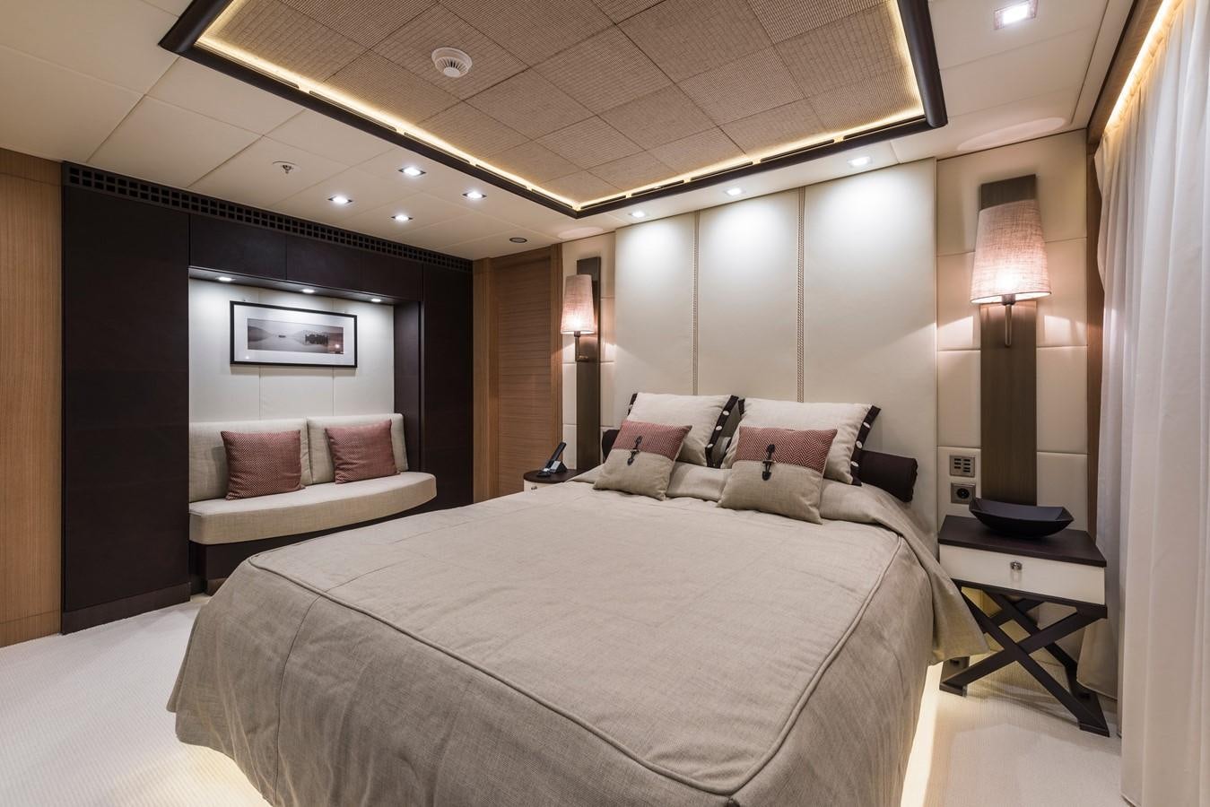 a hotel room with a bed and a lamp aboard I NOVA Yacht for Sale