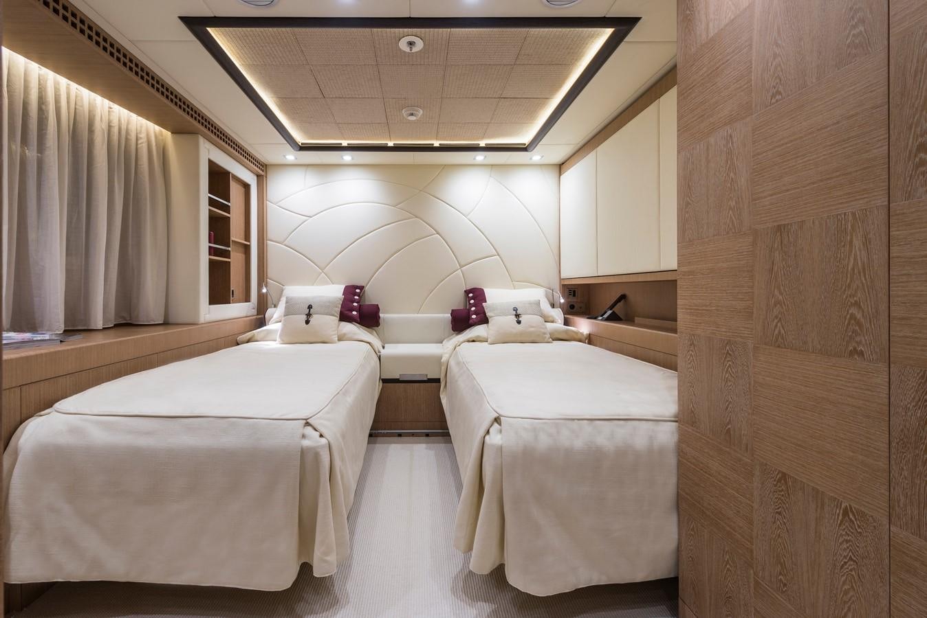 a room with beds and a wood door aboard I NOVA Yacht for Sale