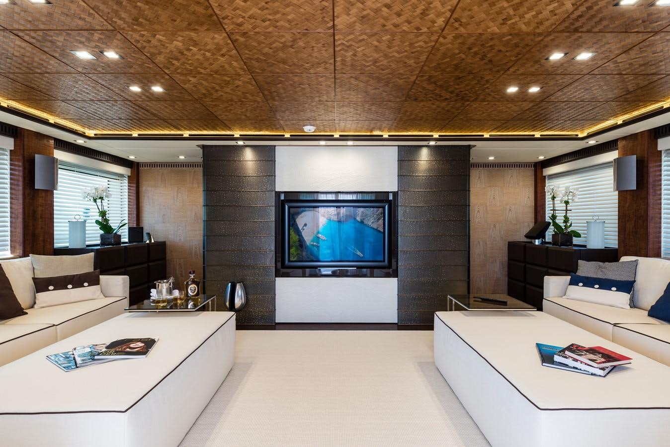 a room with a tv and a couch aboard I NOVA Yacht for Sale