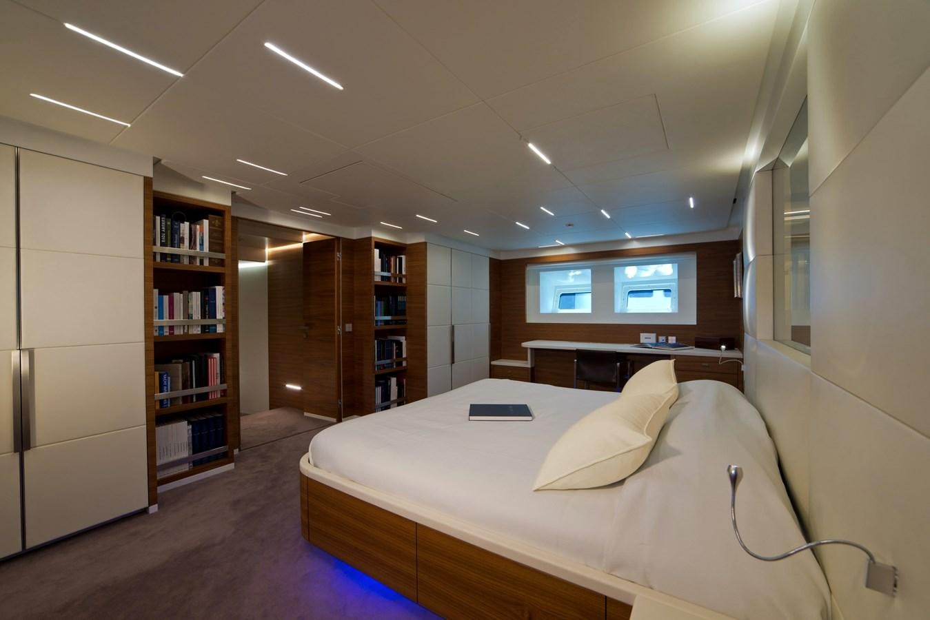a room with a bed and a book shelf aboard NATIVA Yacht for Sale