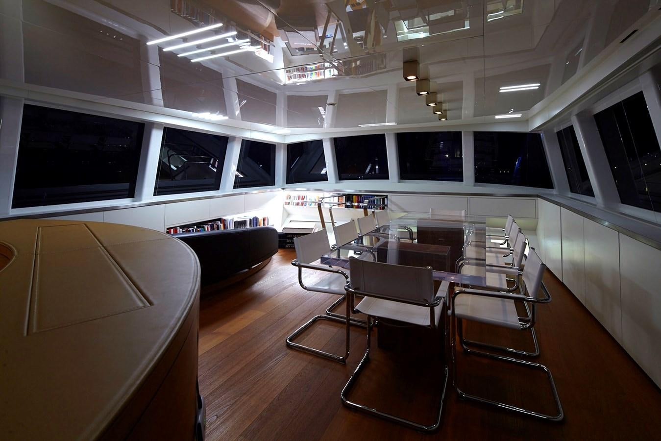 a room with chairs and tables aboard NATIVA Yacht for Sale