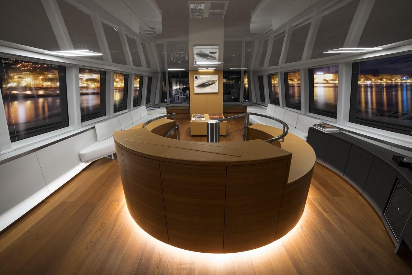 a room with a table and chairs aboard NATIVA Yacht for Sale