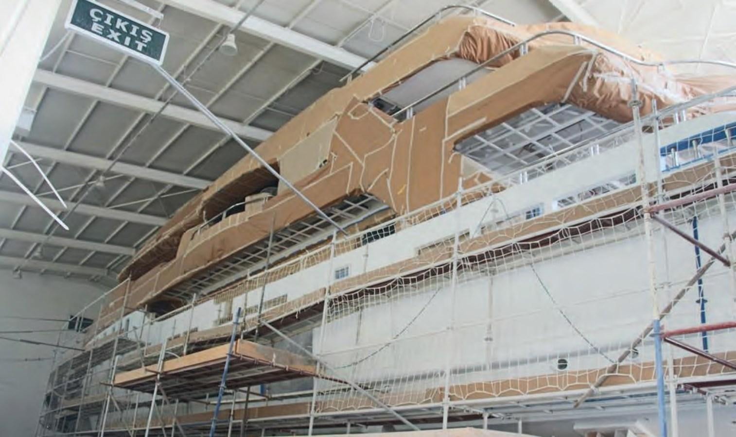 a large building with a lot of windows and a lot of glass aboard HULL#05 Yacht for Sale