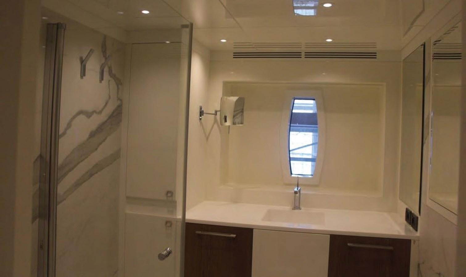 a bathroom with a sink and a shower unit aboard HULL#05 Yacht for Sale