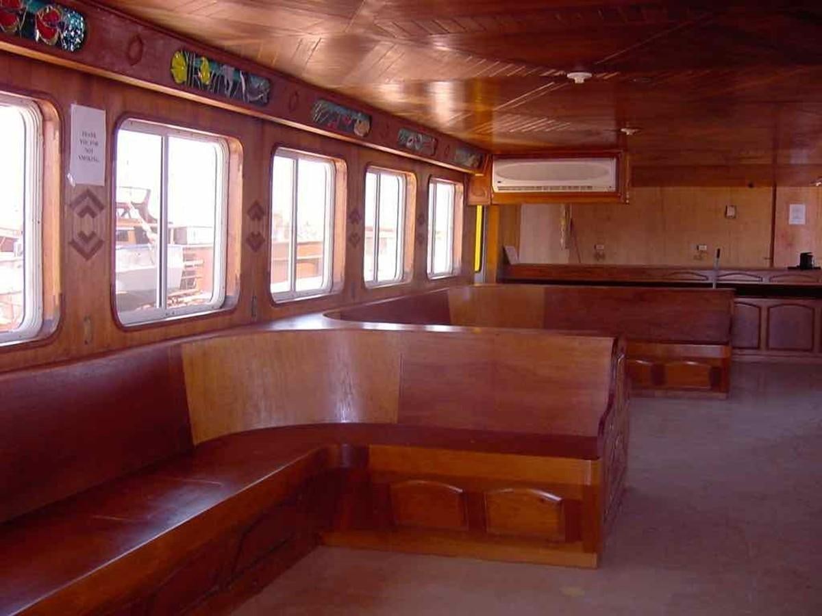 a room with wooden benches aboard PRINCIPE DEL MAR Yacht for Sale
