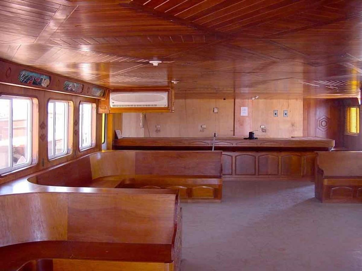 a large room with wooden benches aboard PRINCIPE DEL MAR Yacht for Sale
