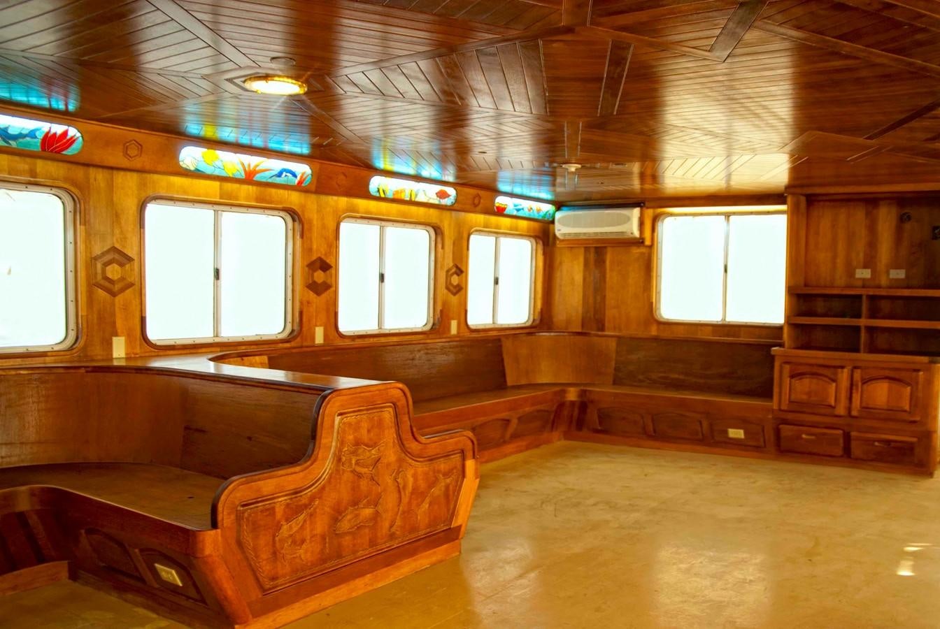 a room with wooden seats aboard PRINCIPE DEL MAR Yacht for Sale
