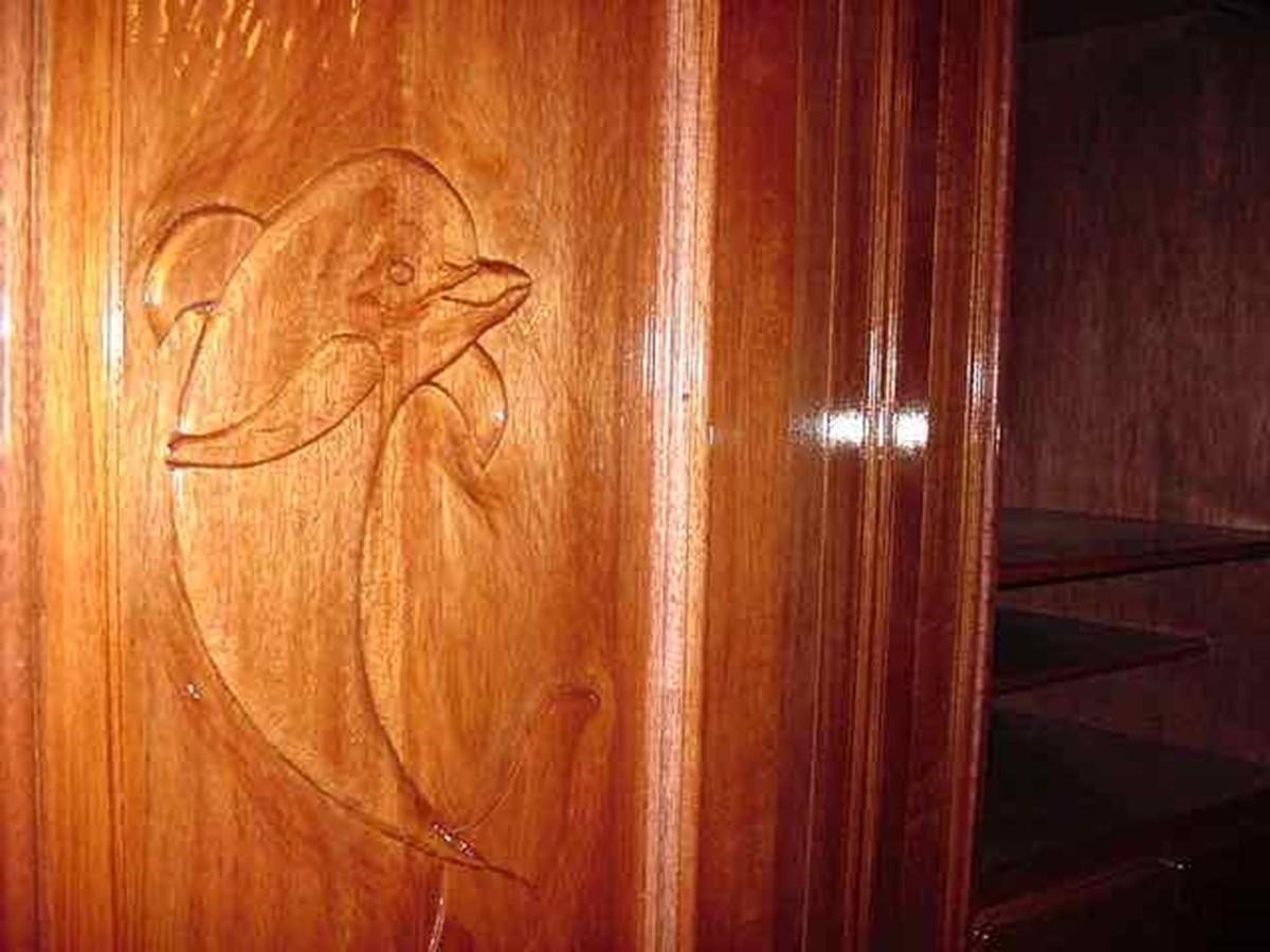 a wood door with a drawing of a person on it aboard PRINCIPE DEL MAR Yacht for Sale