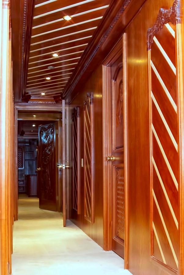 a hallway with wooden walls aboard PRINCIPE DEL MAR Yacht for Sale