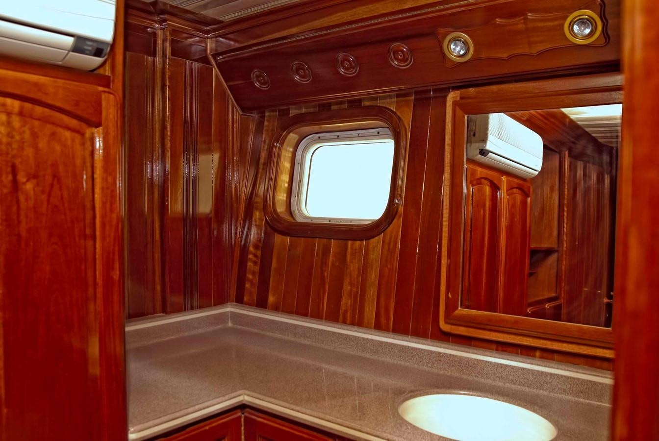 a bathroom with a sink and a mirror aboard PRINCIPE DEL MAR Yacht for Sale