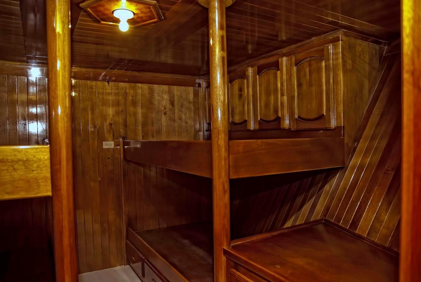 a wooden room with wood walls aboard PRINCIPE DEL MAR Yacht for Sale