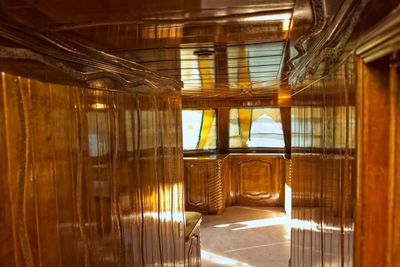 a room with wooden walls aboard PRINCIPE DEL MAR Yacht for Sale