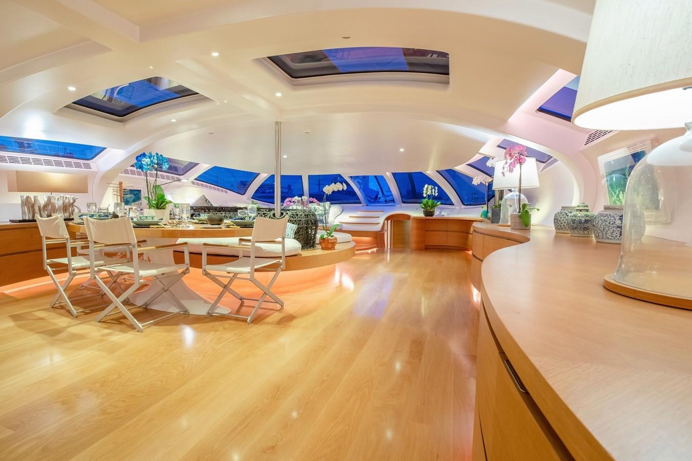 a room with a pool table and chairs aboard ADASTRA Yacht for Sale