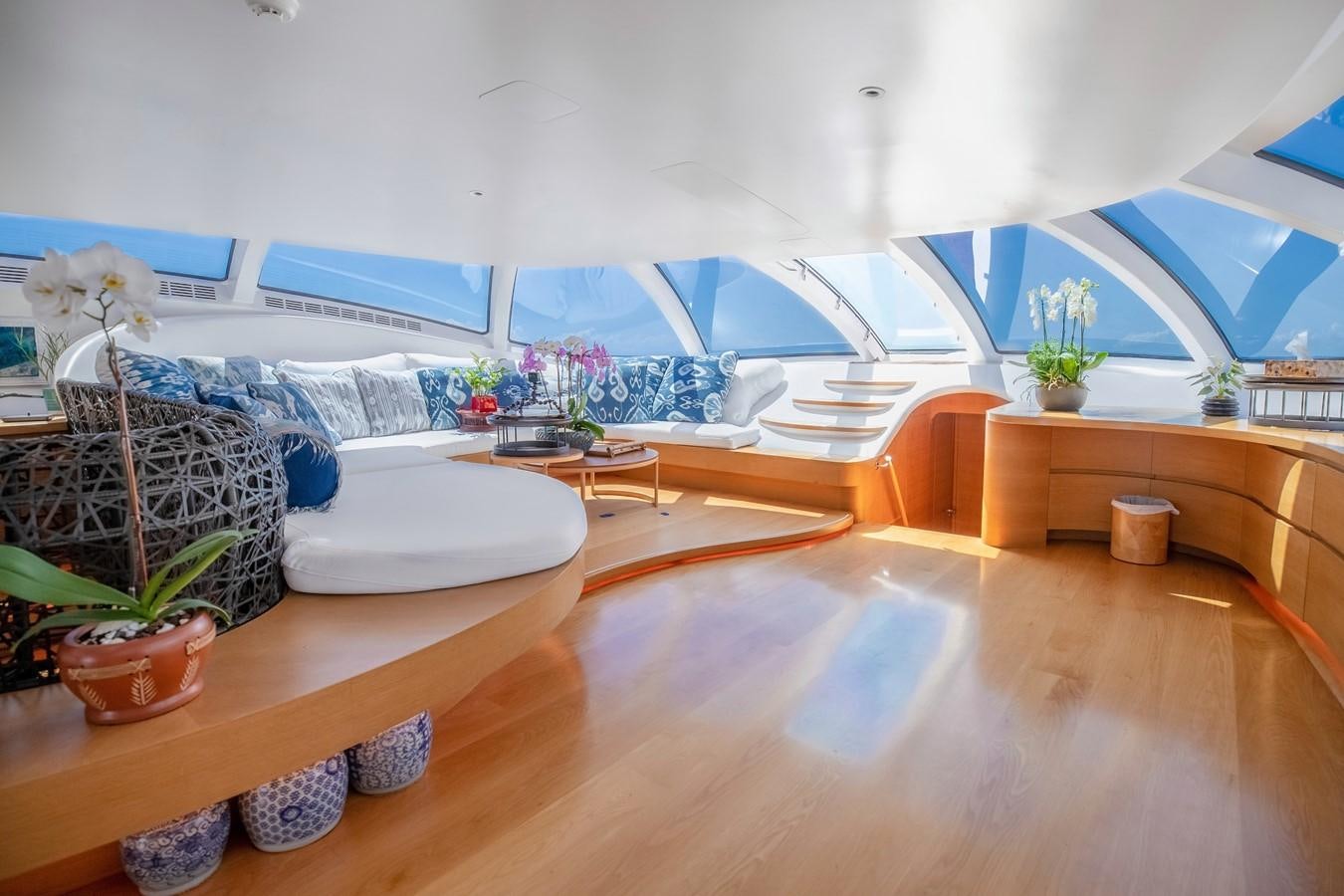 a room with a couch and plants aboard ADASTRA Yacht for Sale