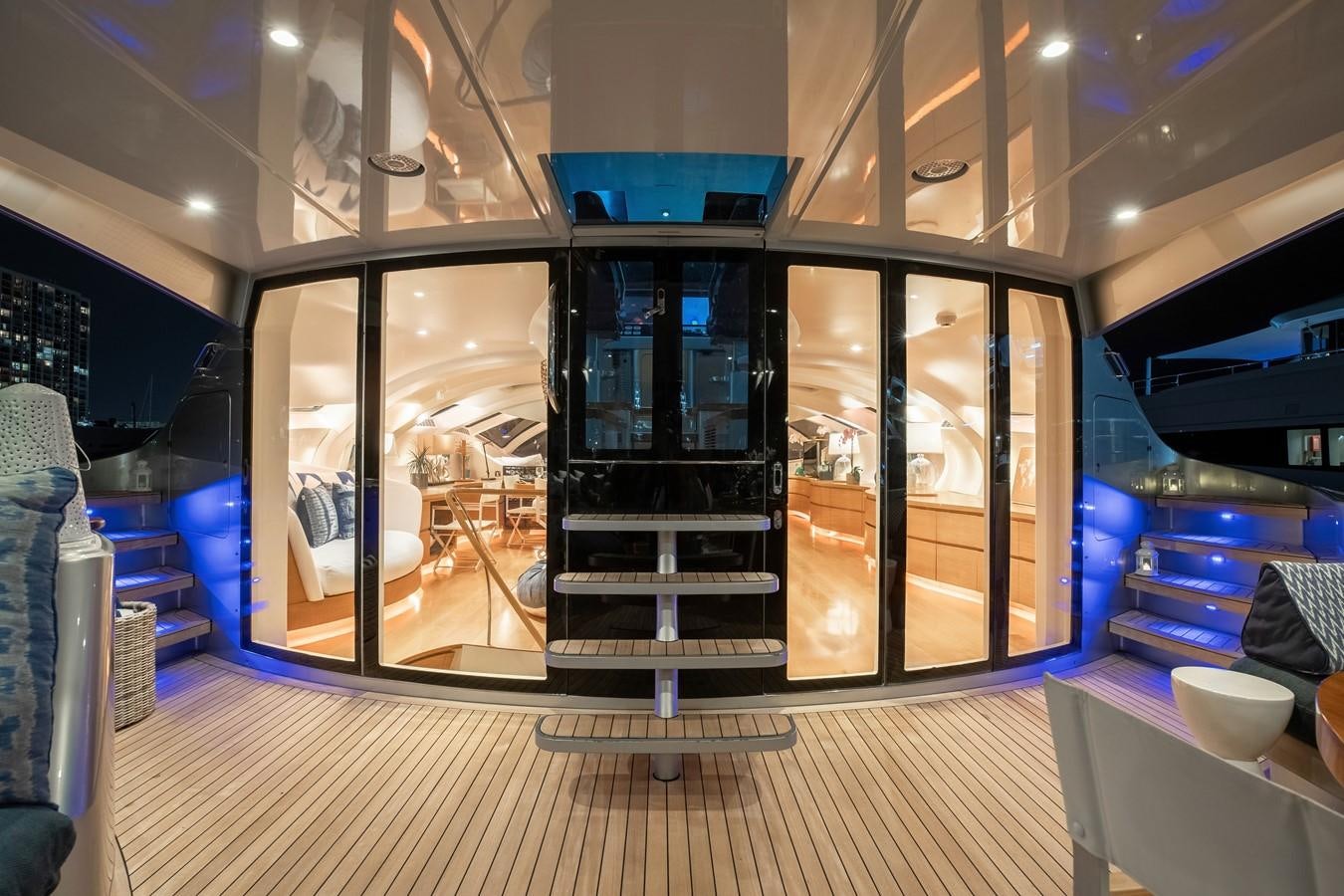 a room with glass doors aboard ADASTRA Yacht for Sale