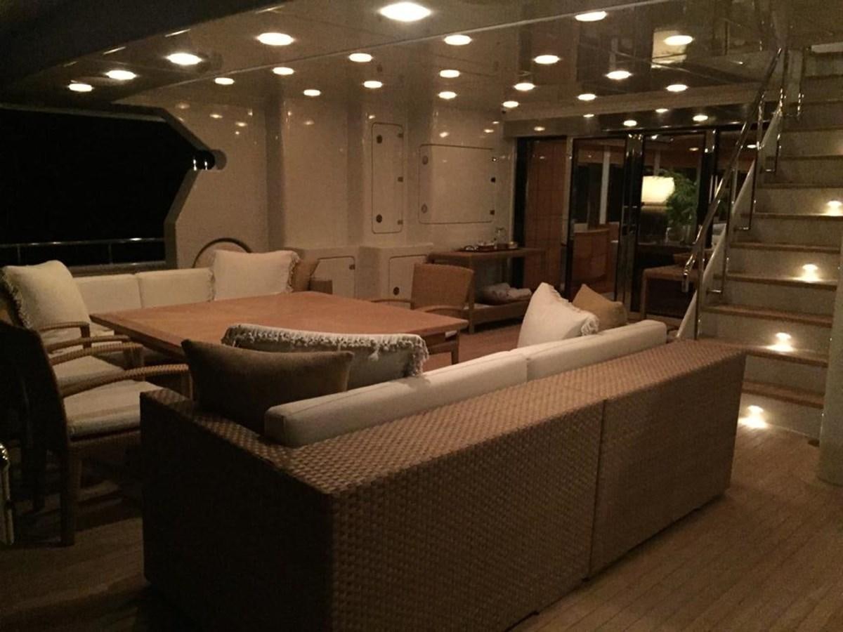 a large living room with a staircase aboard GOLDEN HORN Yacht for Sale