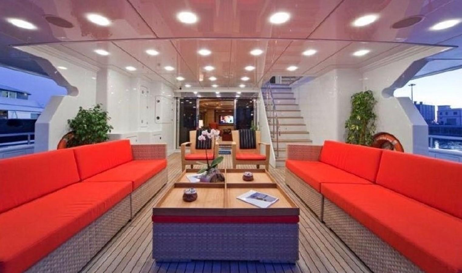a living room with red couches aboard GOLDEN HORN Yacht for Sale