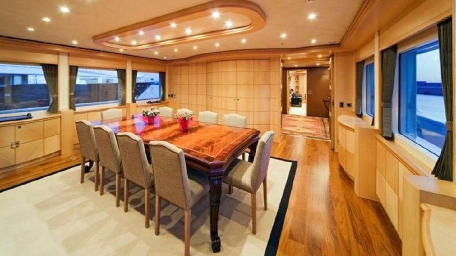 a large dining room with a table and chairs aboard GOLDEN HORN Yacht for Sale
