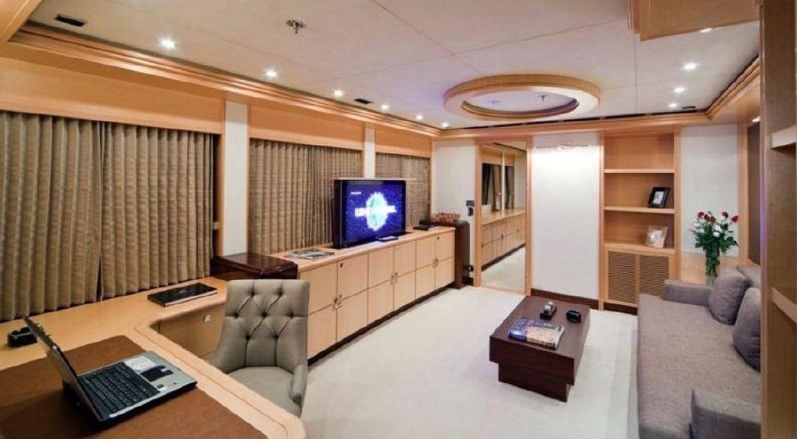 a living room with a large screen aboard GOLDEN HORN Yacht for Sale