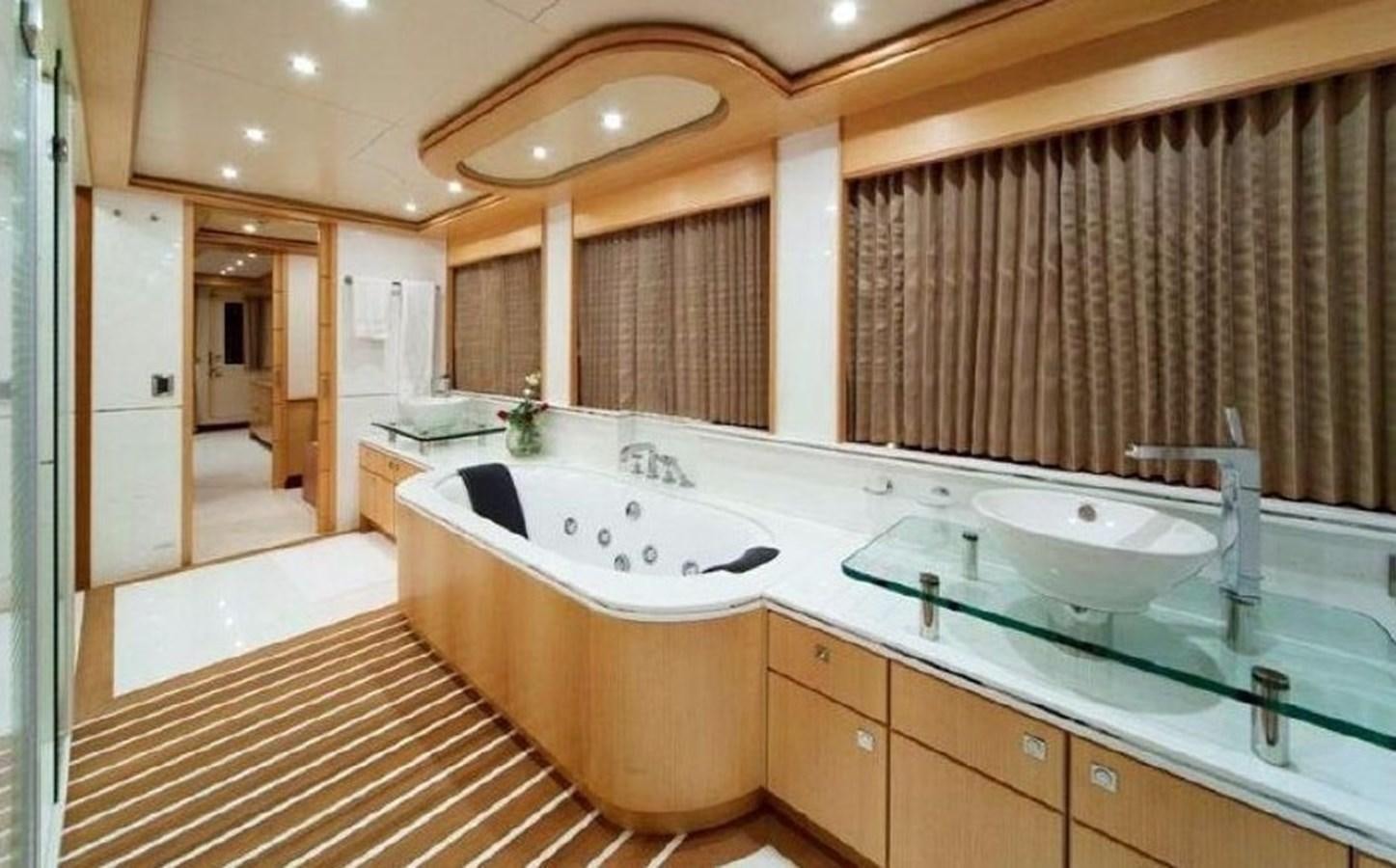 a large bathroom with a large jacuzzi tub aboard GOLDEN HORN Yacht for Sale