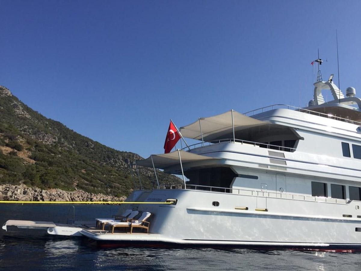 a boat docked at a pier aboard GOLDEN HORN Yacht for Sale