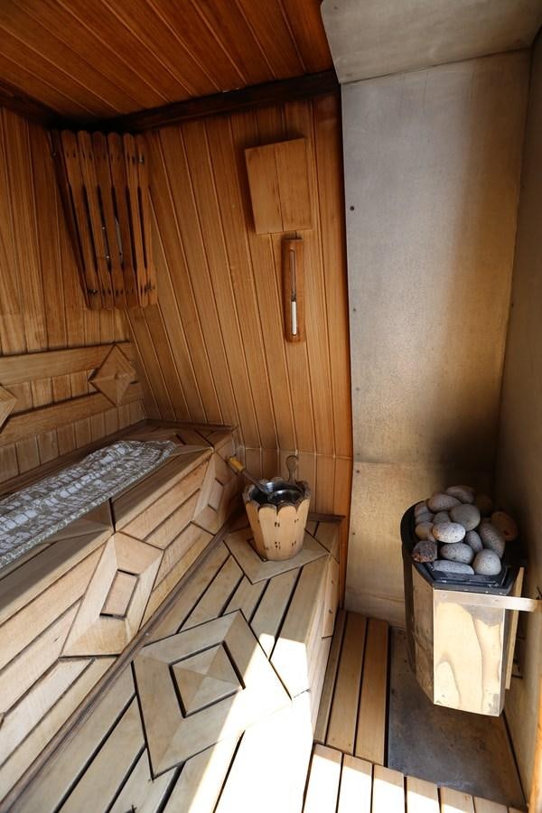 a room with a wood wall and a tub aboard GOODWILL Yacht for Sale