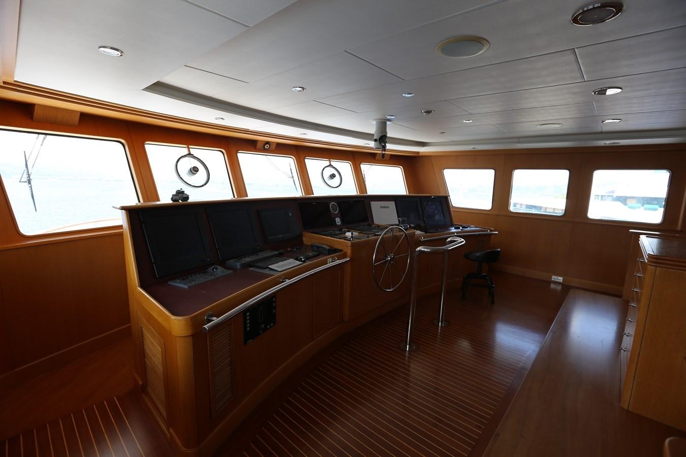 a room with a piano and a desk aboard GOODWILL Yacht for Sale