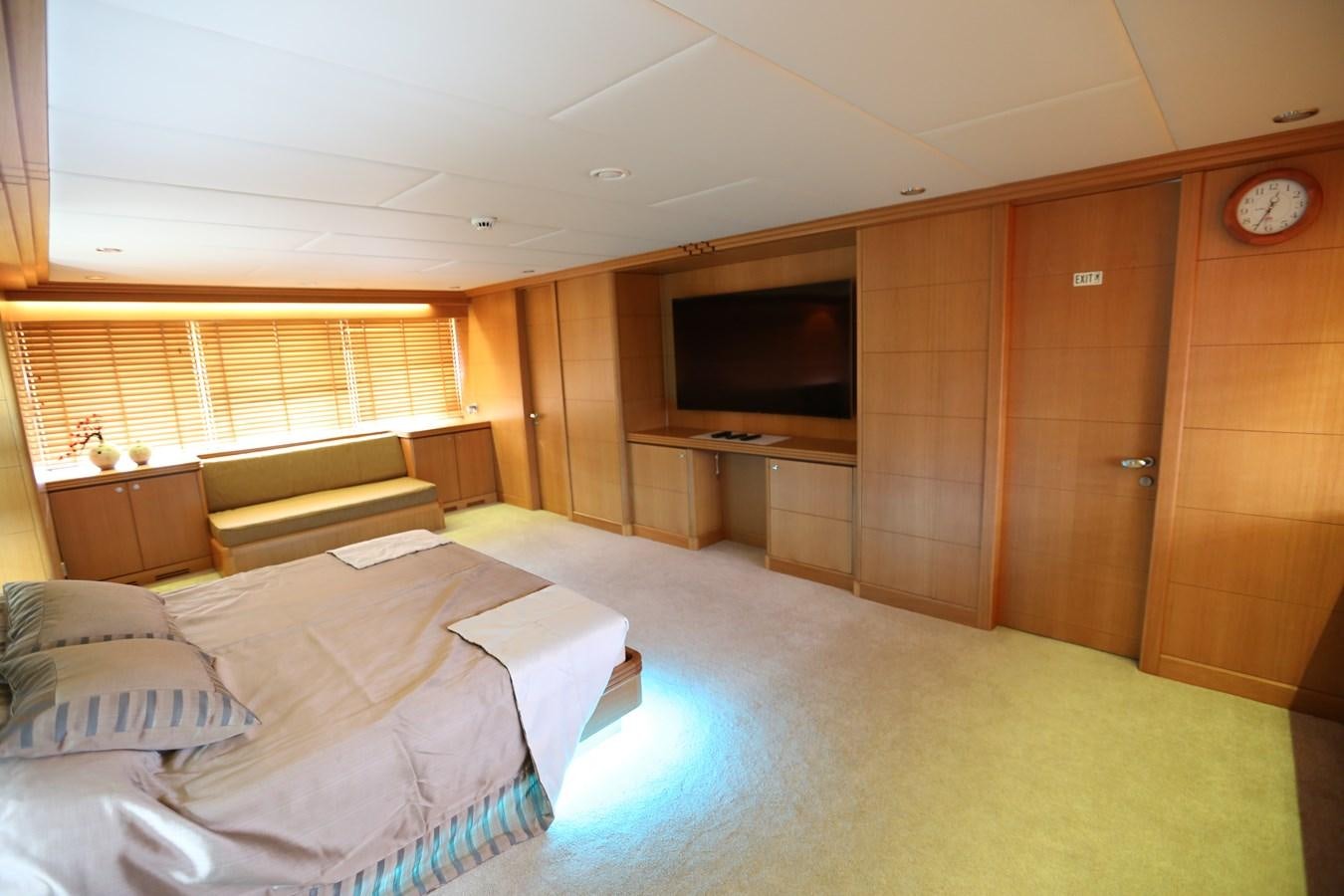 a bedroom with a bed and a tv aboard GOODWILL Yacht for Sale