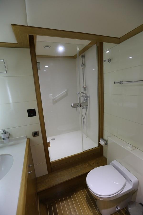 a bathroom with a shower and toilet aboard GOODWILL Yacht for Sale