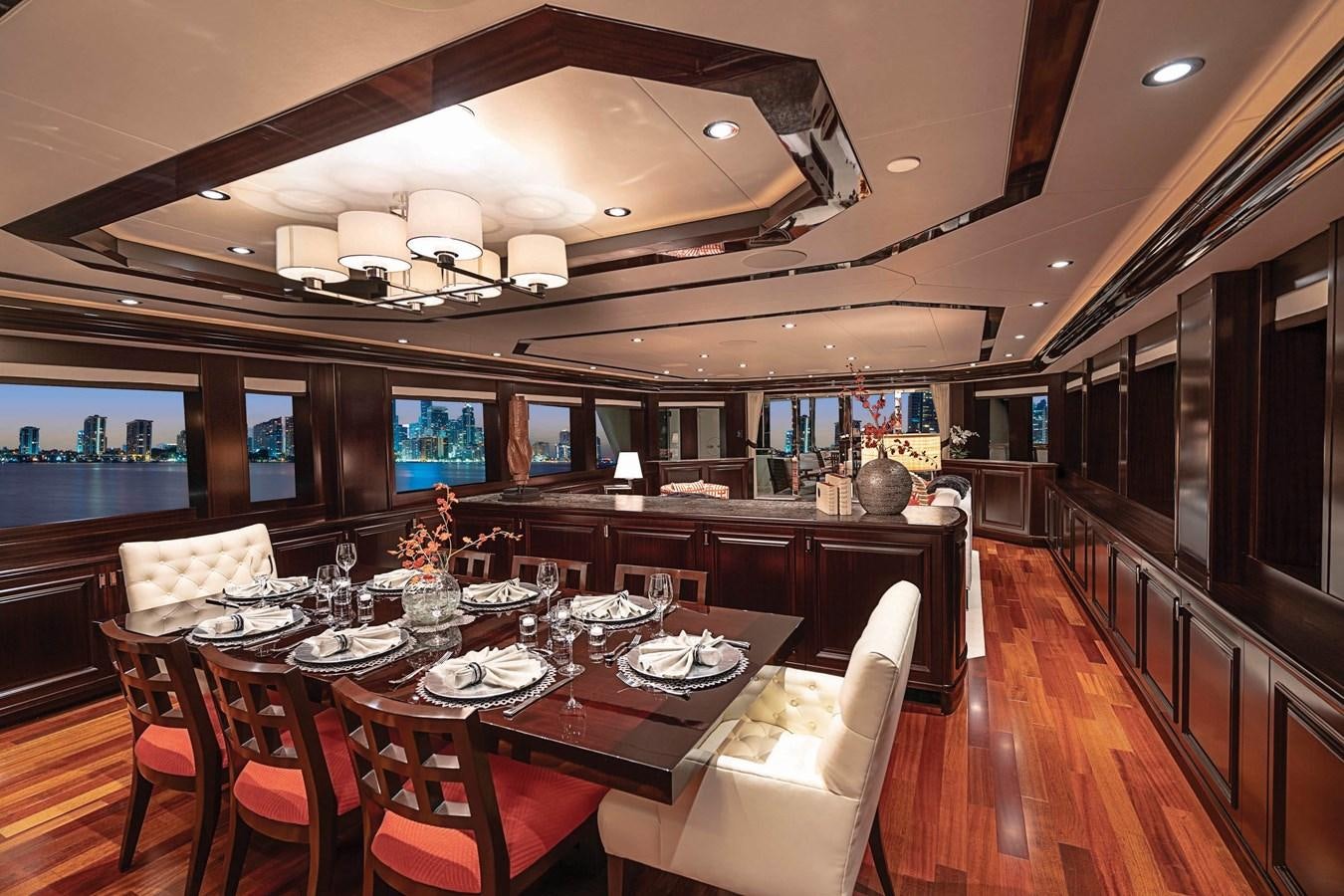 a dining room with a table set for a meal aboard RELEASE ME Yacht for Sale