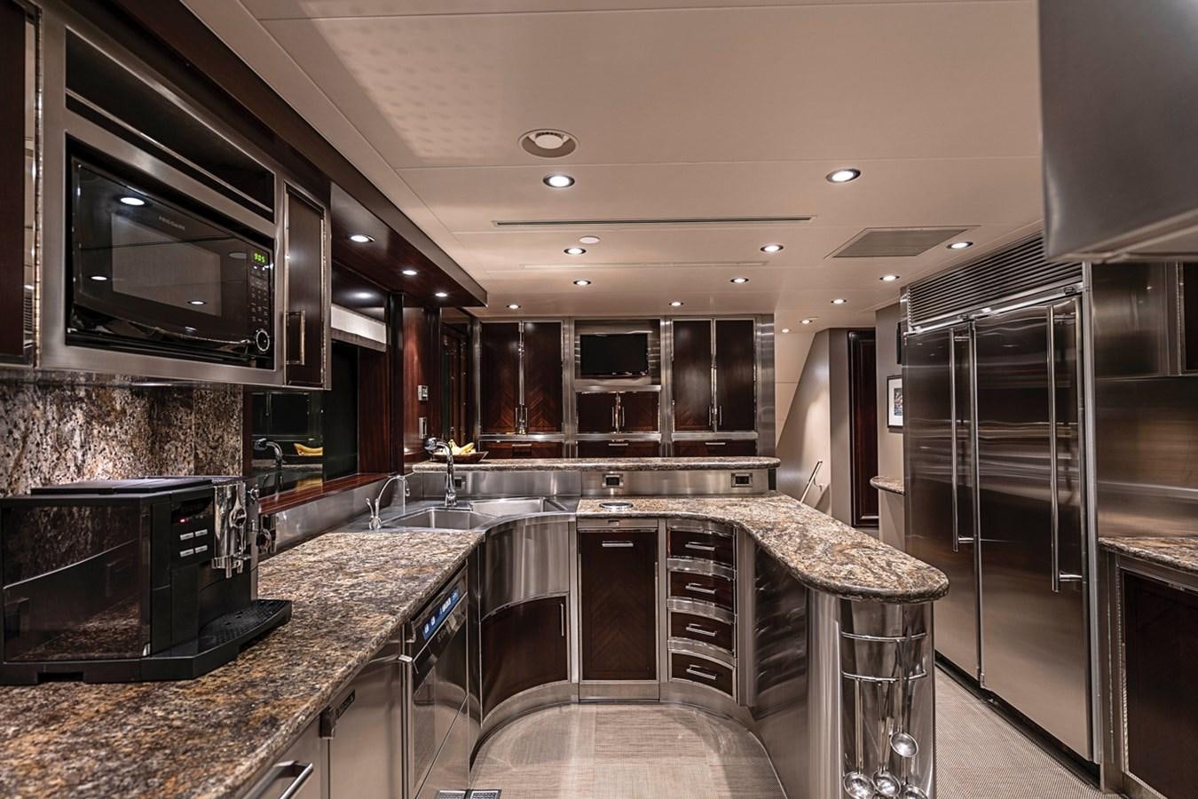 a kitchen with stainless steel appliances aboard RELEASE ME Yacht for Sale