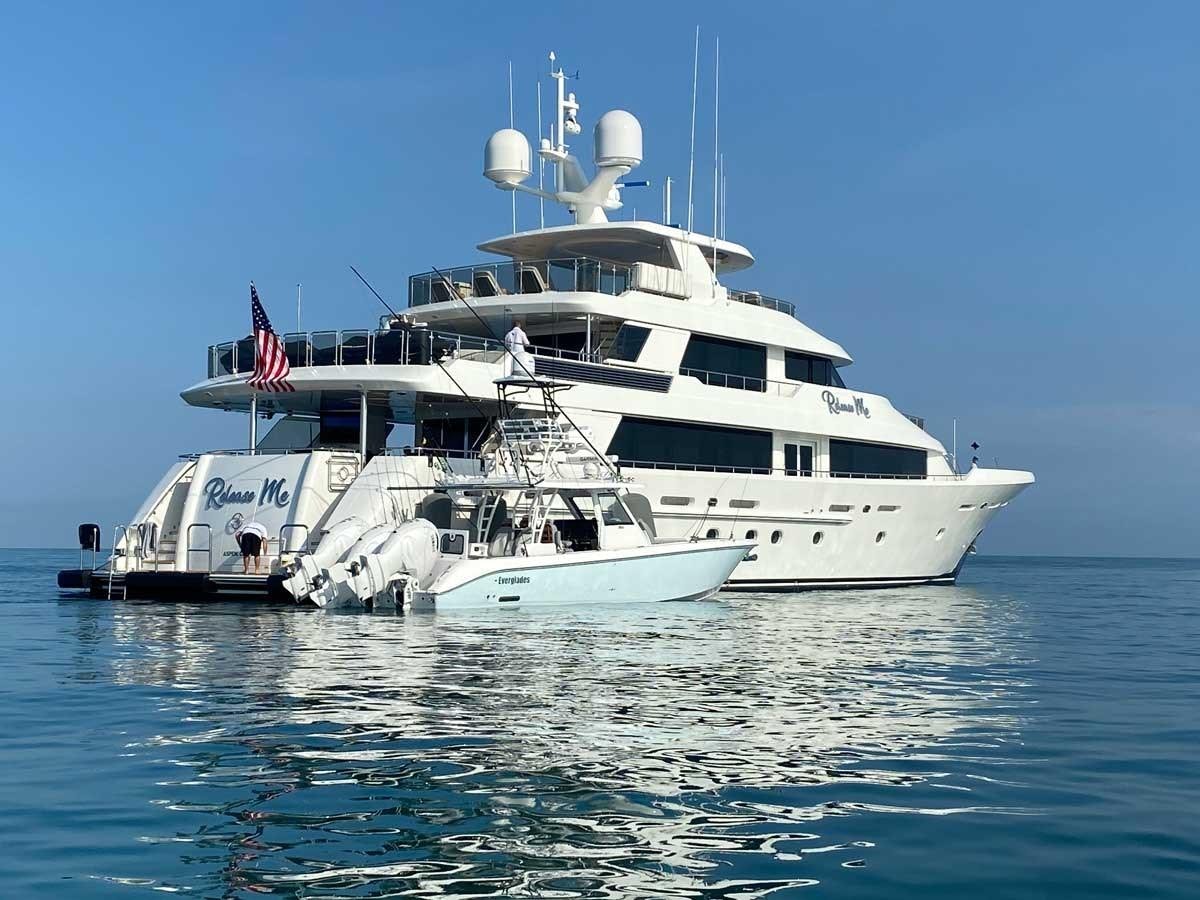 a large white boat in the water aboard RELEASE ME Yacht for Sale