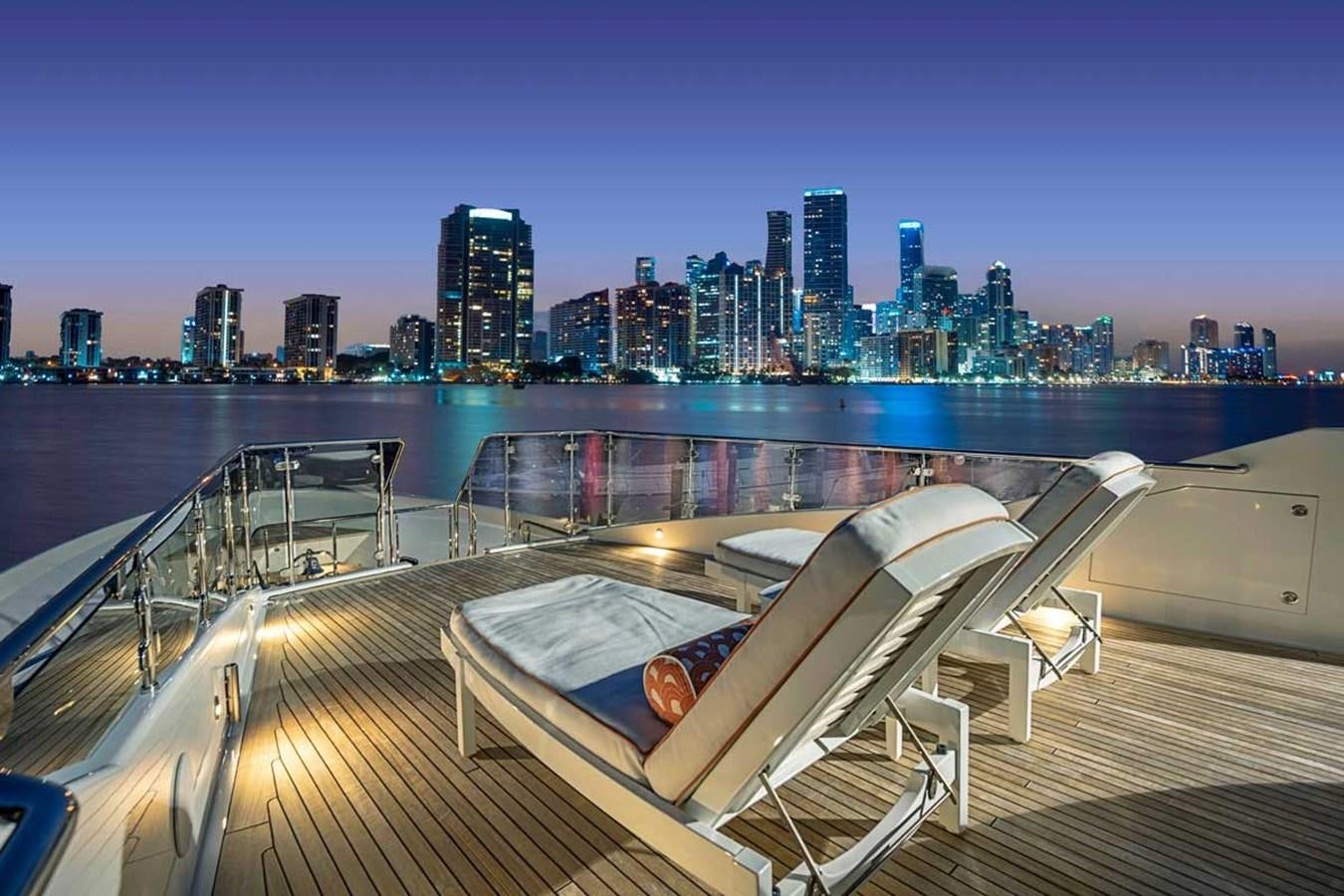 a deck overlooking a city skyline aboard RELEASE ME Yacht for Sale