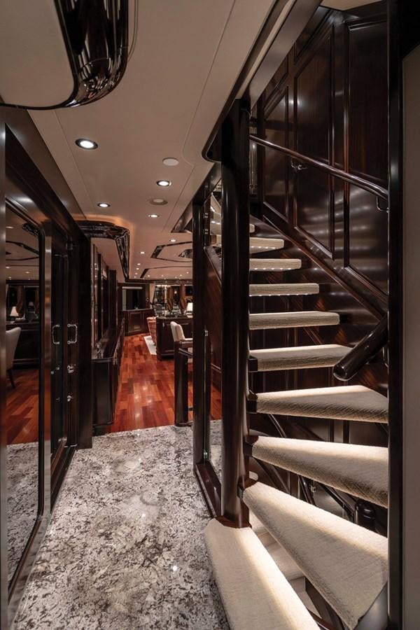a hallway with a large metal staircase aboard RELEASE ME Yacht for Sale