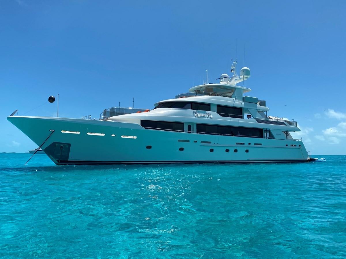 a large white boat in the water aboard RELEASE ME Yacht for Sale