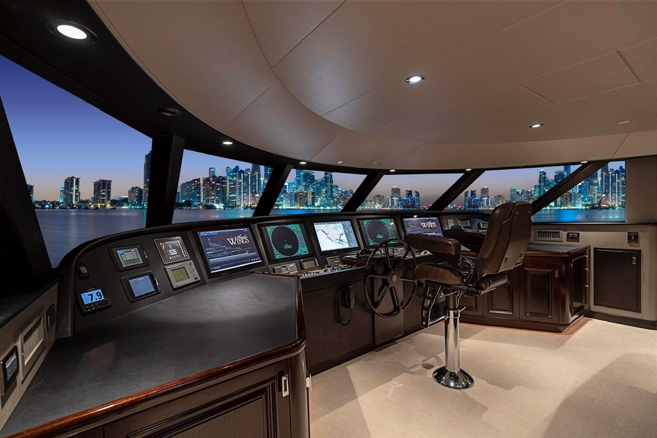 a room with a desk and chairs aboard RELEASE ME Yacht for Sale