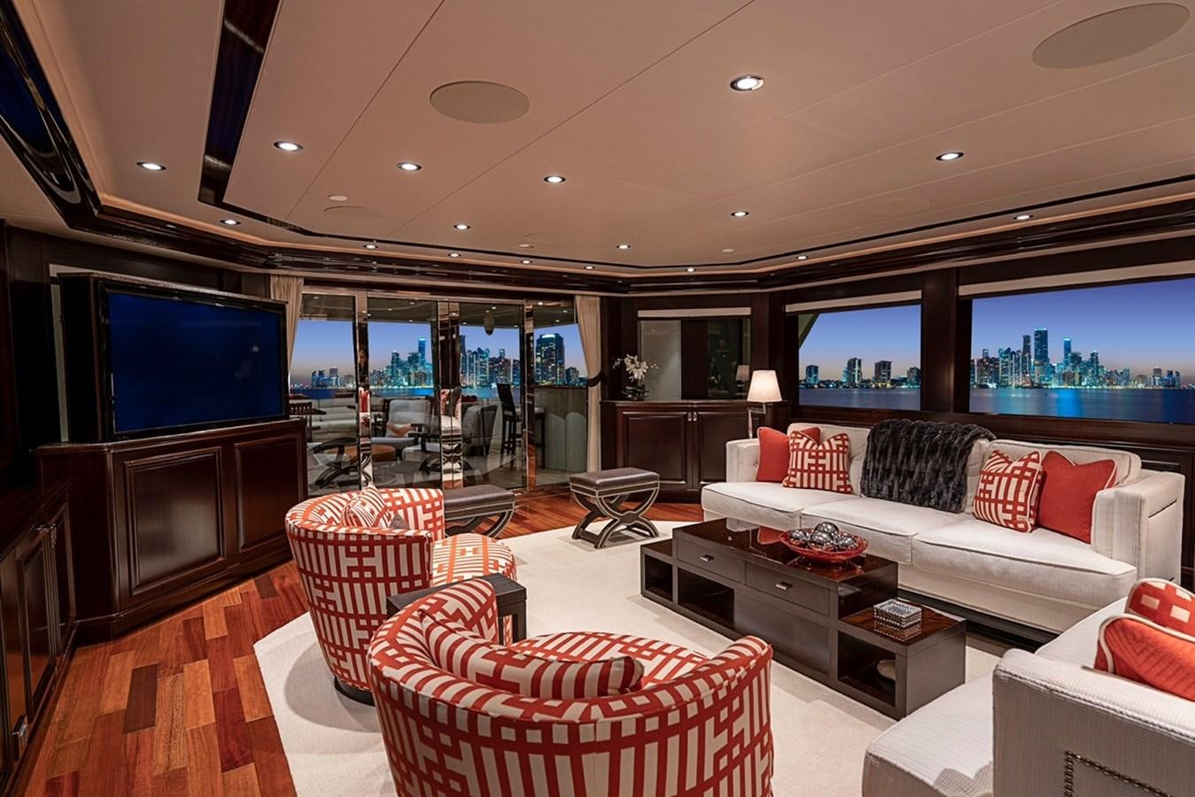 a living room with a large screen aboard RELEASE ME Yacht for Sale