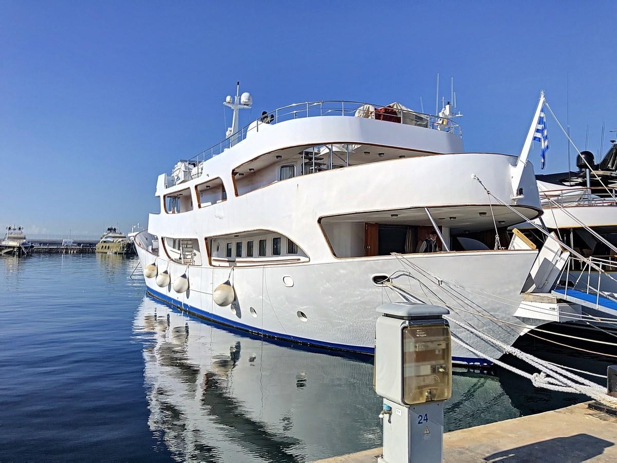 a large white boat in the water aboard ELIKI Yacht for Sale
