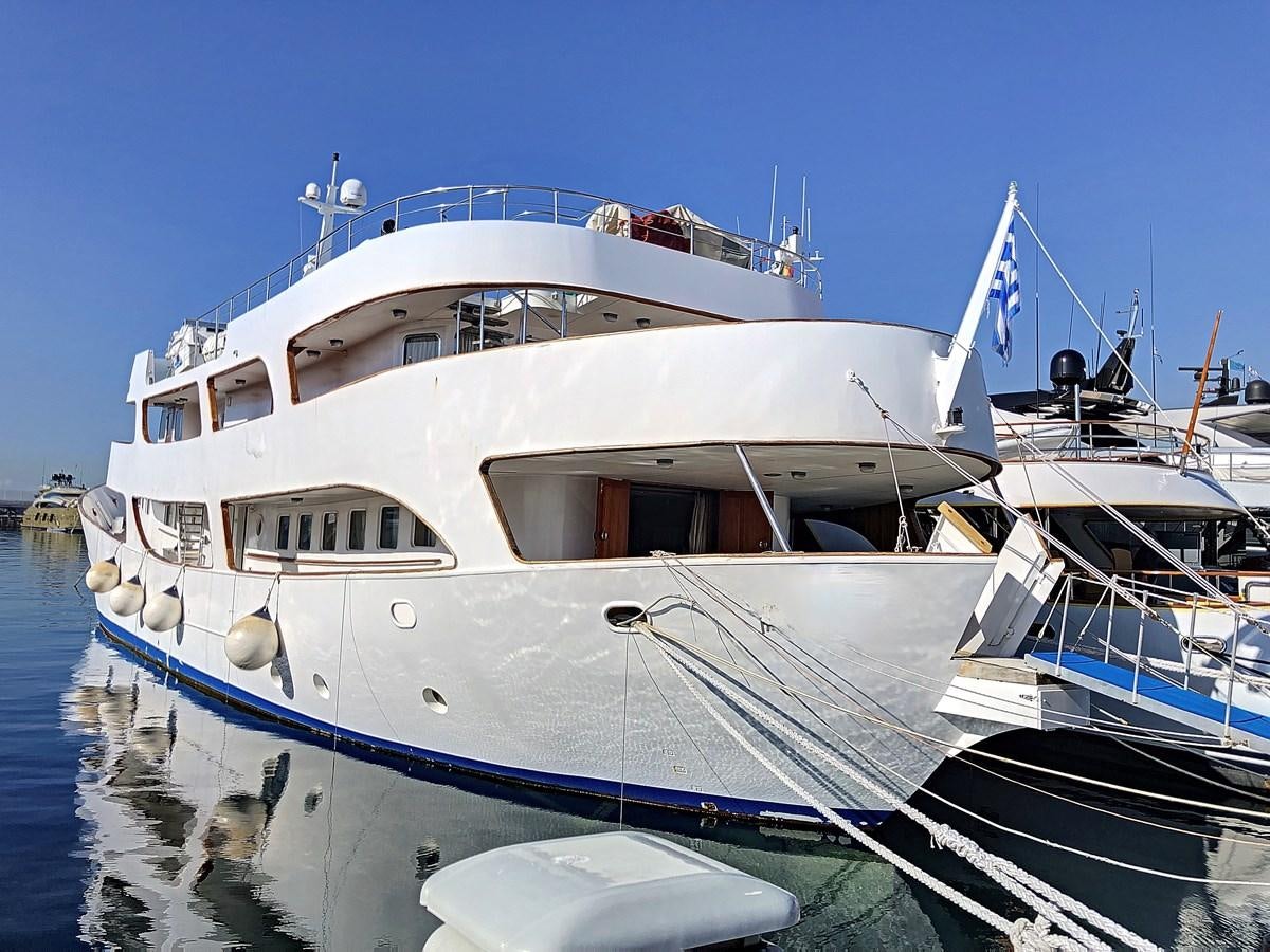 a large white boat in the water aboard ELIKI Yacht for Sale